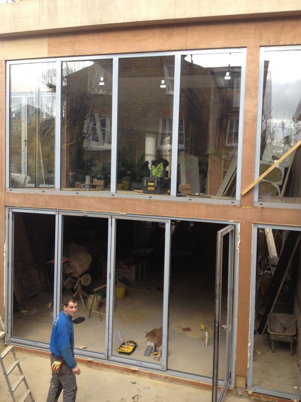 Aluminium bi-fold doors with two-storey glazing in St Albans
