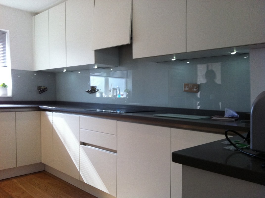 Grey glass kitchen splashback with LED lighting in St Albans