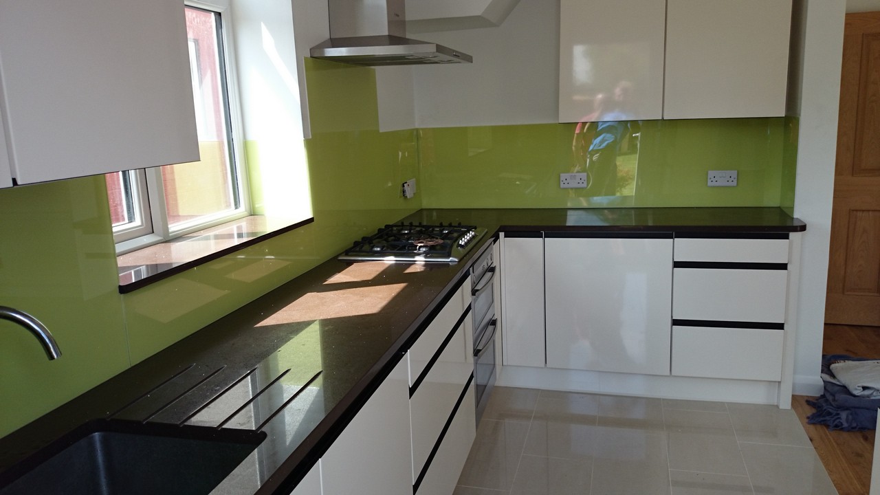 Lime green glass kitchen splashback installed by St Albans glaziers