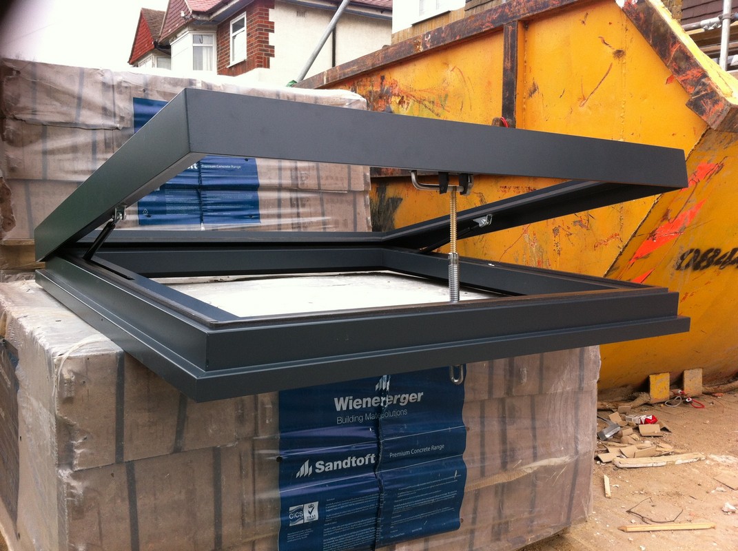 Opening flat roof skylight in anthracite grey installed in St Albans